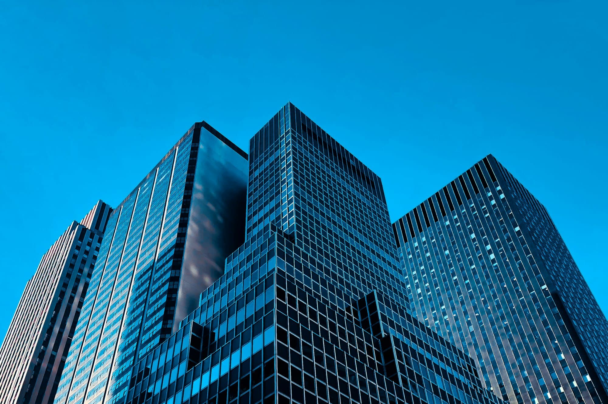 Premium glass office tower in Tel Aviv at dusk